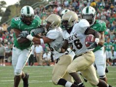 Kim Kardashian Shows Off Deep Cleavage In Plunging Top & Mini NFL Players1