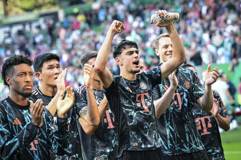 Bayern's players celebrate after the German Bundesliga soccer match between SV Werder Bremen and Bayern Munich in Bremen.