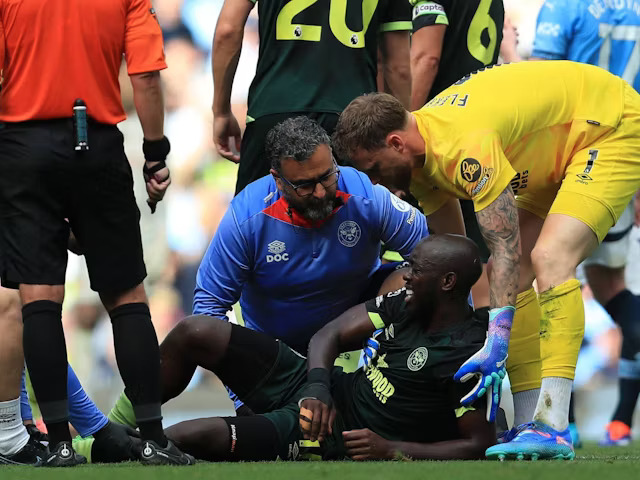 Yoane Wissa lay injured against Man City.